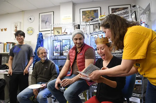 At the going-away party: From left are Andrew Young of the Phil Ward lab; Phil Ward, professor of entomology at UC Davis; Amir Ghoddoucy, formerly with the California Department of Food and Agriculture; Jessica Gillung (opening her card), and Tabatha Yang, education and outreach coordinator at the Bohart Museum of Entomology. (Photo by Kathy Keatley Garvey)