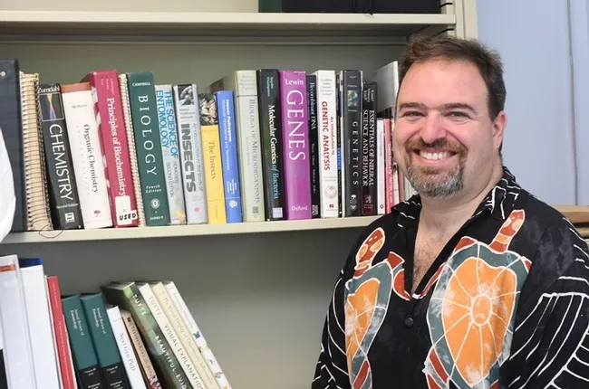 Medical entomologist Geoffrey Attardo in his office in Briggs Hall, UC Davis campus. (Photo by Kathy Keatley Garvey)