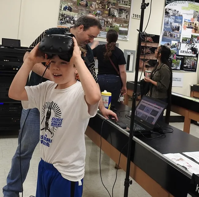 "That was cool!" Sebastian Ehrlich removes the headset. (Photo by Kathy Keatley Garvey)