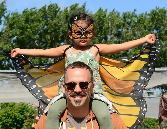 A monarch for a day! Pollinator Posse member, Seth Newton Patel of Oakland and his 4-year-old daughter Saathiya Patel, 4, helped out at the third annual Butterfly Summit. (Photo by Kathy Keatley Garvey)