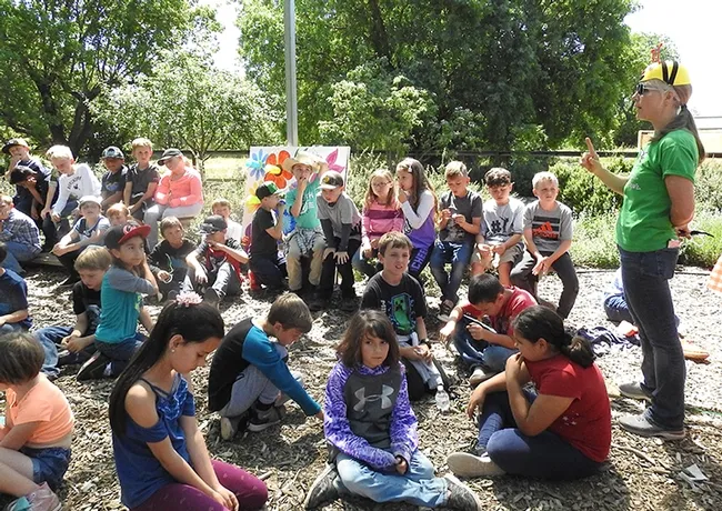 Wendy Mather, program manager of the California Master Beekeeper Program (CAMBP), tells the students she hopes to see them study entomology at UC Davis. (Photo by Kathy Keatley Garvey)