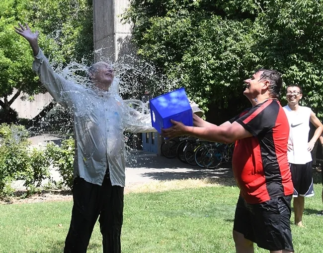 In this 2018 photo, "splash brothers" Bruce Hammock (left) and Christophe Morisseau go at it. (Photo by Kathy Keatley Garvey)