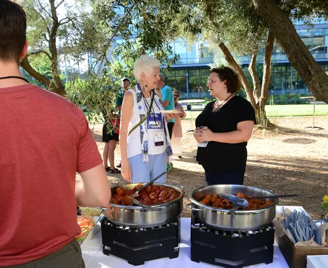 Pollinator champion Phyllis Stiles (left) of the Xerces Society for Invertebrate Conservation chats with Extension apiculturist Elina Lastro Niño of the UC Davis Department of Entomology and Nematology at the Thursday night reception. Niño and Professor Neal Williams are co-chairing the International Pollinator Conference. (Photo by Kathy Keatley Garvey)