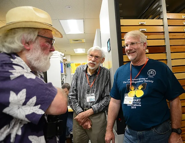 Entomologist Bill Patterson (center) of Sacramento and Lepidopterists' Society president Brian Scholtens, entomology professor at the College of Charleston, South Carolina, discuss butterflies with scientist-author Robert Michael Pyle, founder of the Xerces Society for Invertebrate Conservation. (Photo by Kathy Keatley Garvey)