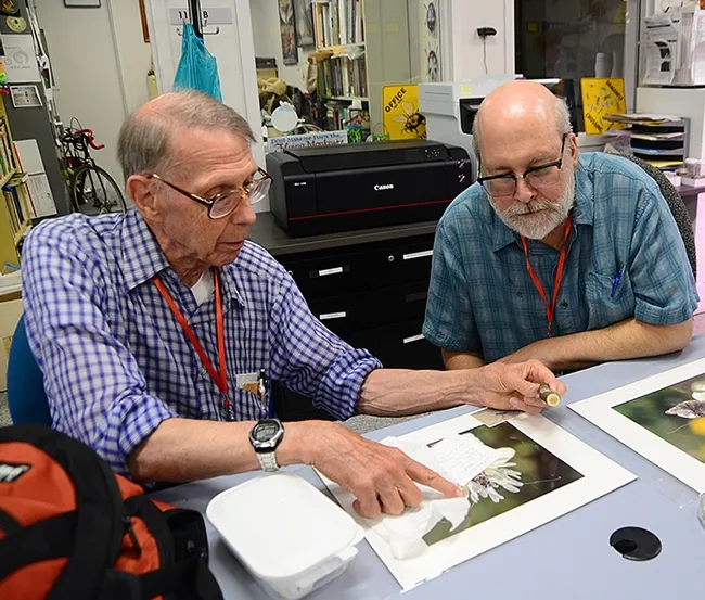 Society members Karl Gardener (left) and William Shepherd confer on a species. (Photo by Kathy Keatley Garvey)