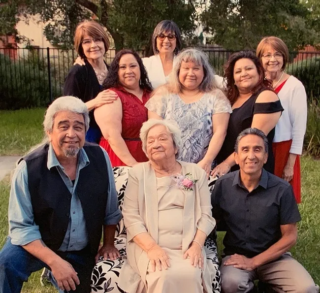 The Galvan family is close-knit. In front (from left) are Joaquin Galvan of Dixon, mother Lilia Galvan of Dixon, and Bonifacio Galvan of Sonora, known for the thriving company that he founded in his garage, Galvan Fly Reels. In the second row (from left) are Elvira Galvan Hack, Dixon; Sandra Galvan, Elmira, and Amanda Galvan, Dixon. In back (from left) are Lilia Felix, Washington state; Virginia "Virgie" Freitas, Vallejo; and Lydia Rodrigues, Arizona. Lilia and Lydia are twins.