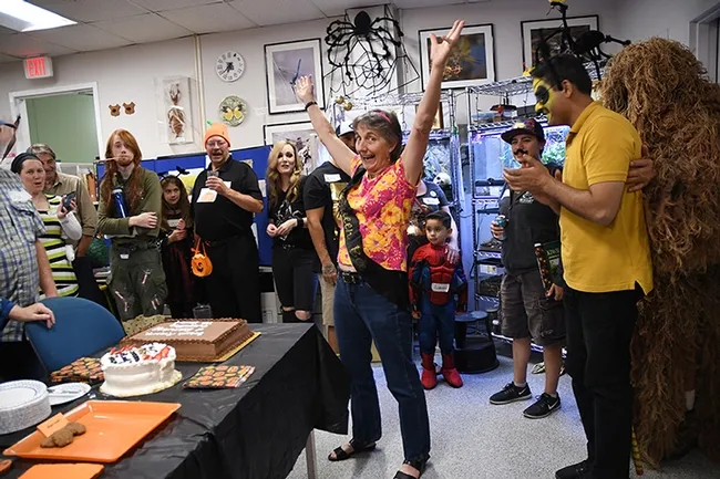 Lynn Kimsey, director of the Bohart Museum of Entomology, welcomes the crowd to the Halloween party. (Photo by Kathy Keatley Garvey)