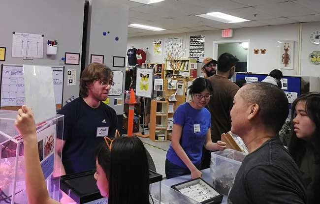 Doctoral student and Bohart associate Ziad Khouri talks to visitors about tarantulas and millipedes. (Photo by Kathy Keatley Garvey)
