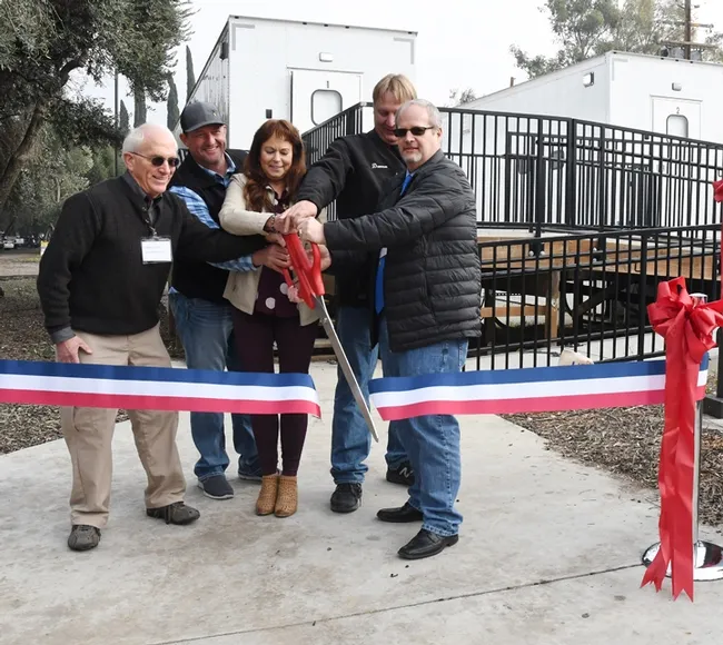 And it's snipped! From left are almond pollination consultant Robert Curtis of Carmichael, retired director of agricultural affairs, Almond Board of California; Brad Pankratz of Can-Am Apiaries, Orland; Jackie Parks-Burris of Jackie Park-Burris Queen Bees, Palo Cedro and a past president of California State Beekeepers' Association; Darren Cox, Logan, Utah, past president of American Honey Producers; and Kelvin Adee of Bruce, S.D., president of American Honey Producers.