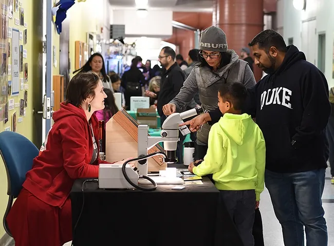 Visitors learned from doctoral student Charlotte Alberts how assassin flies catch their prey. (Photo by Kathy Keatley Garvey)