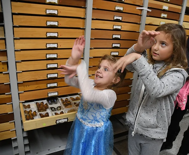 Olivia Miller, 4, and her sister, Savannah, 7, demonstrate how butterflies fly. (Photo by Kathy Keatley Garvey)