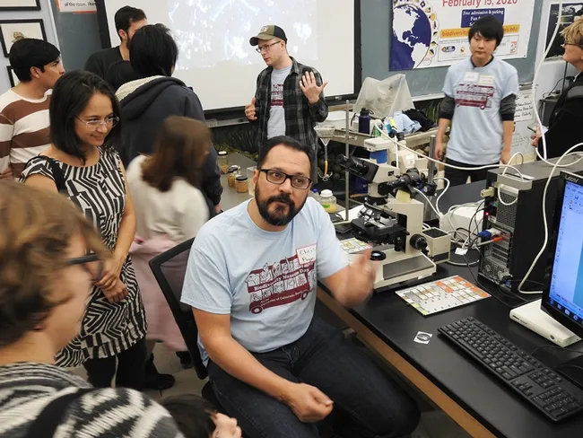 Nematologists Christopher Pagan (foreground) and Corwin Parker, doctoral students in the UC Davis Department of Entomology and Nematology, answer questions from the crowd at the UC Davis Biodiversity Museum Day. (Photo by Kathy Keatley Garvey)