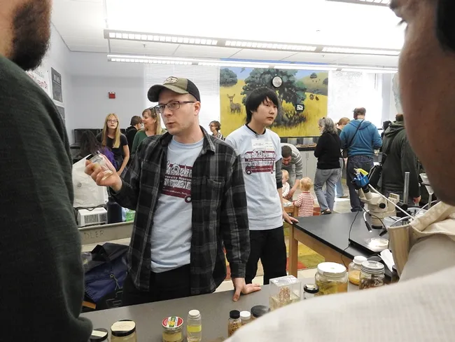 Nematologist Corwin Parker, doctoral student, UC Davis Department of Entomology and Nematology, answers a question about nematode parasites. (Photo by Kathy Keatley Garvey)
