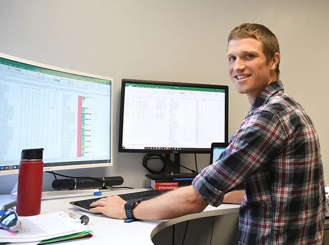 Agricultural entomologist and Cooperative Extension specialist Ian Grettenberger in his office in Briggs Hall, UC Davis. (Photo by Kathy Keatley Garvey)