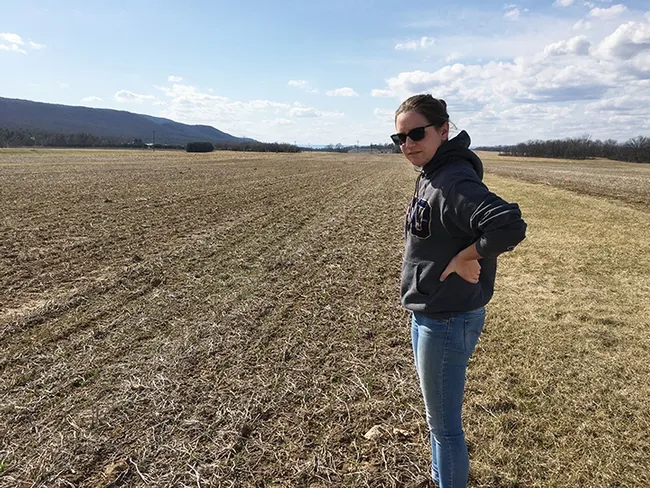 UC Davis alumnus Kirsten Pearsons, a "proud Aggie," surveys the Russell E. Larson Agricultural Research Center at Rock Springs; this is Penn State's research farm. She holds a doctorate in entomology from Penn State.