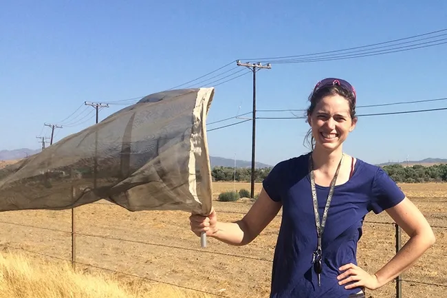 Doctoral student Erin Calfee with her collecting net.