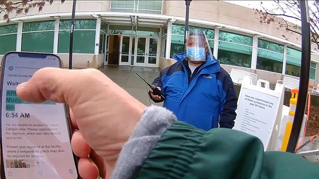 UC Davis distinguished professor Walter Leal is his way to obtain a COVID-19 saliva test at a UC Davis kiosk. The saliva tests are given, by appointment, to members of the UC Davis and Davis communities. (Photo by Walter Leal)