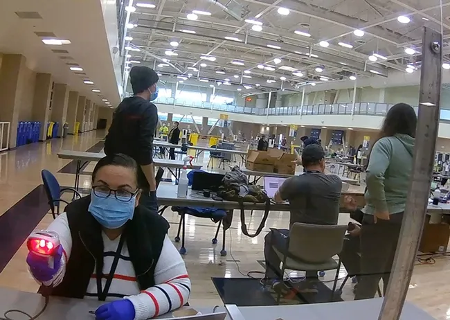 An image taken at a UC Davis kiosk where members of the UC Davis and Davis communities are given COVID-19 saliva tests. (Photo by Walter Leal)