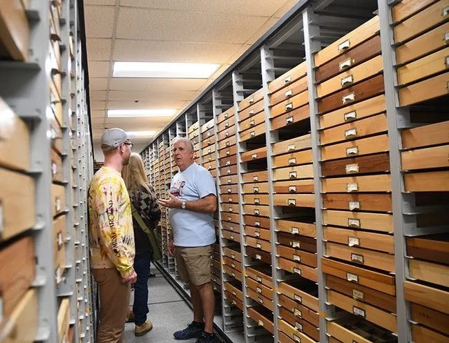 Entomologist Jeff Smith, curator of the Lepidoptera section at the Bohart Museum of Entomology, answers questions from UC Biodiversity Museum Day visitors. (Photo by Kathy Keatley Garvey)