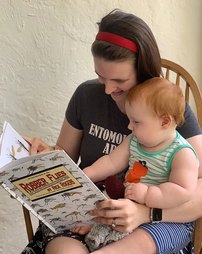 UC Davis doctoral candidate Charlotte Herbert Alberts reads to her son, Griffin, born in April of 2020.
