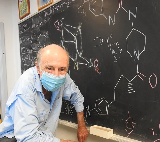 A chalkboard details some of the work that UC Davis distinguished professor Bruce Hammock is doing. (Photo by Kathy Keatley Garvey)