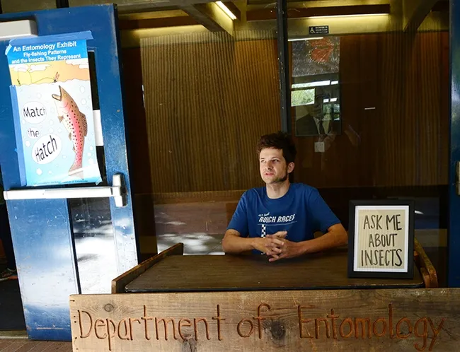 Doctoral candidate Zach Griebenow, as a Bug Doctor, is ready for your questions. He specializes in ants. (Photo by Kathy Keatley Garvey)