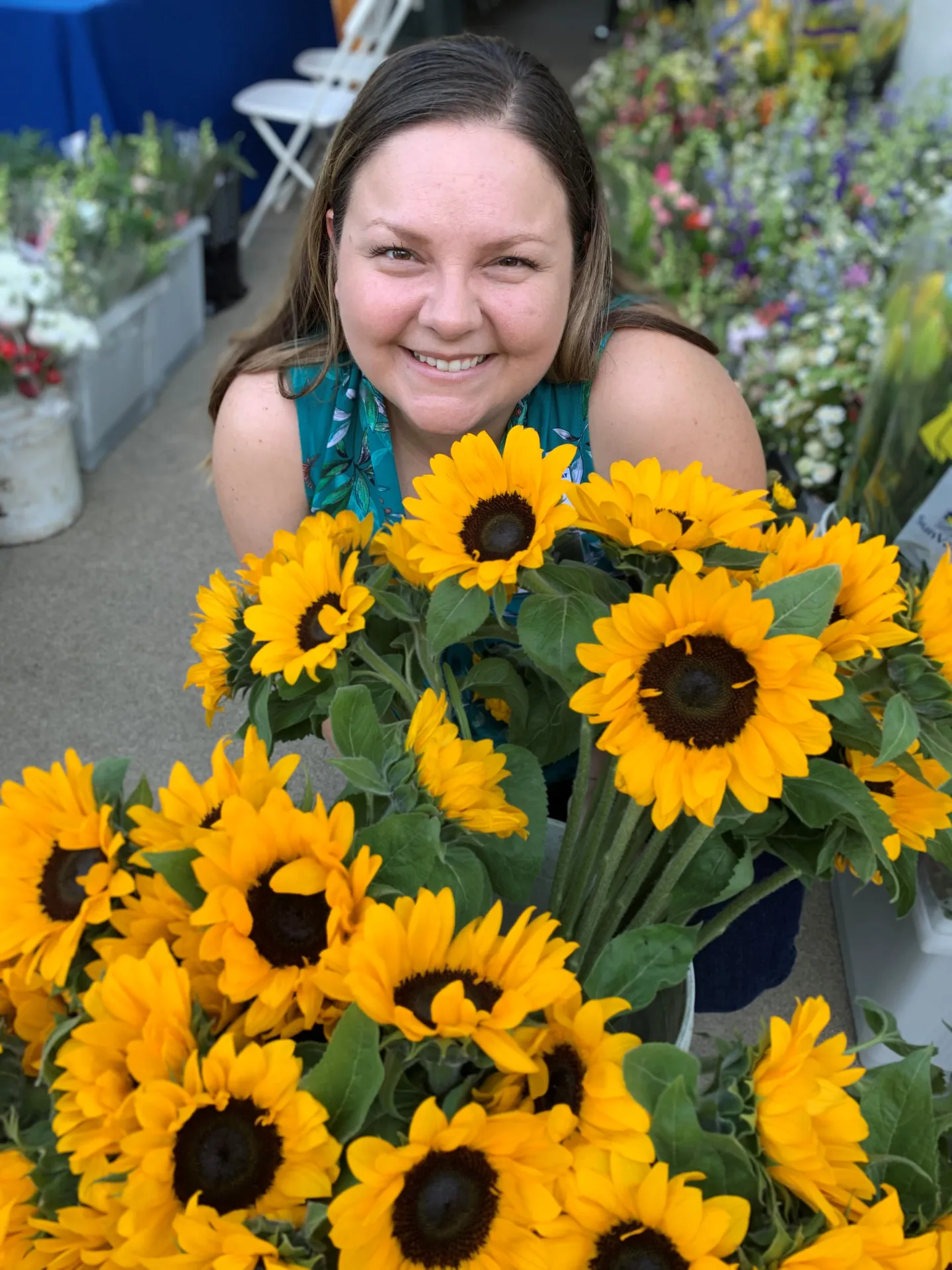 Alex surrounded by flowers