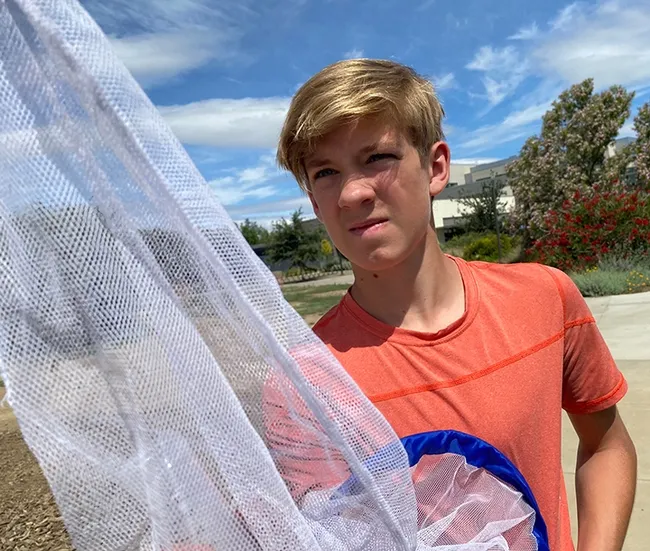 Atlas participant Elliot McReynolds of Davis, checks out his net. (Photo by Cindy McReynolds)