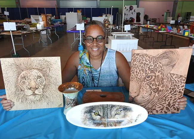 Talented artist Iris Mayhew of American Canyon entered these pieces in the Solano County Fair. She drew inspiration from her safari in Kenya. Her work will be displayed June 16-19 in McCormack Hall. She'll be depicting monarchs and Gulf Fritillaries next. (Photo by Kathy Keatley Garvey)