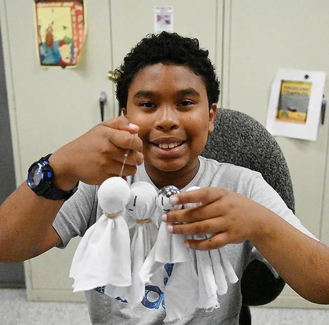 A very creative youngster, 10-year-old Isaac Nottie, shows his family of gall ghosts. (Photo by Kathy Keatley Garvey)