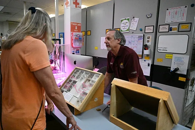 Bohart Museum senior museum scientist Steve Heydon answers a question from an open house visitor. (Photo by Kathy Keatley Garvey)