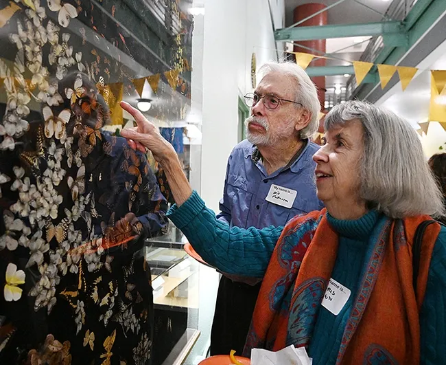 Bohart associate and butterfly collector Bill Patterson and his wife, Doris Brown, Sacramento residents, admire the "Spiral Galaxy of Butterflies." (Photo by Kathy Keatley Garvey)
