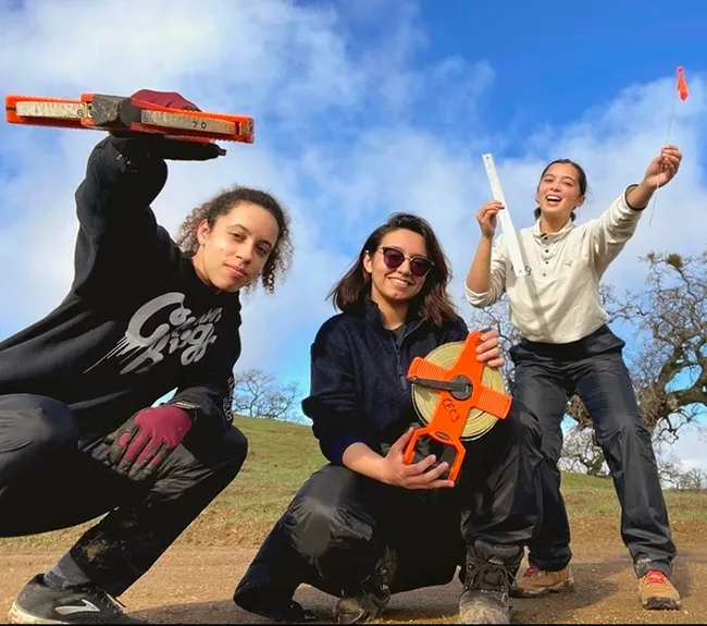Bita Rostami (center) with fellow researchers, Logan Ruggles and Marissa Lopez, at the Blue Oak Ranch Reserve in San Jose. This project was part of the California Ecology and Conservation, UC Natural Reserve System. They were measuring the abundance of yarrow, Achillea millefolium, in burned out areas and unburned areas of the reserve. (Photo by Logan Ruggles)