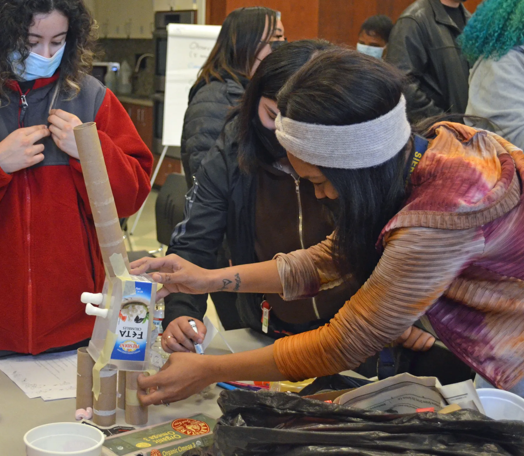 YES teen teachers at training building designs