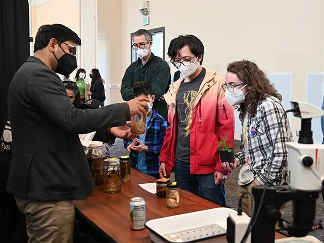 Nematologist Shahid Siddique of the UC Davis Department of Entomology and Nematology talks to guests at the 2022 UC Davis Biodiversity Museum Day. (Photo by Kathy Keatley Garvey)