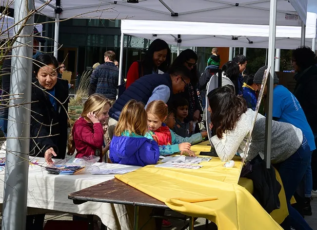 Know your plants! This group of young visitors at the UC Davis Arboretum and Public Garden display gets acquainted with plants. (Photo by Kathy Keatley Garvey)