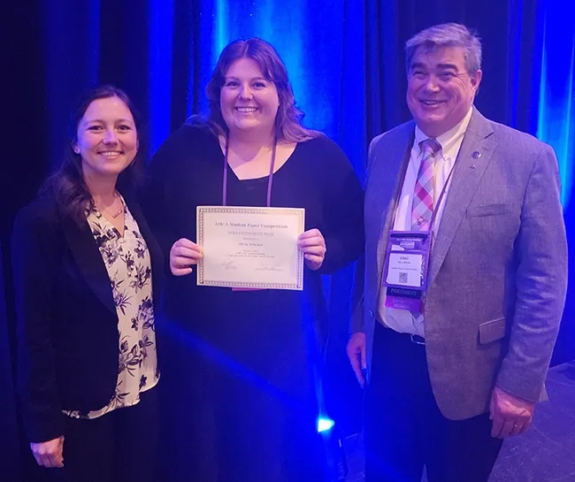 Congratulating Olivia Winokur (center), recipient of the Hollandsworth Prize for best student presentation at the American Mosquito Control Association (AMCA) annual conference are Casey Crockett (left), AMCA Student Competition coordinator, and Dennis Wallette, 2022-2023 AMCA president.