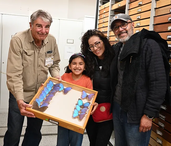Bohart associate Greg Kareofelas (left) poses for a photo with a visiting family from Mexico City: Martha Leija and Mario Preciado and their daughter Valentina, 8. (Photo by Kathy Keatley Garvey)