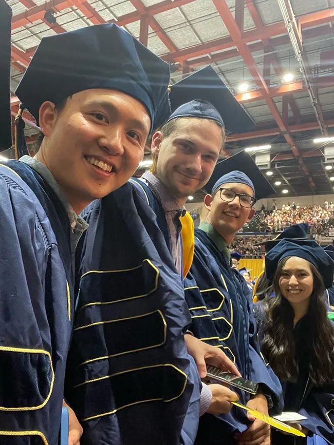 Molecular geneticist-physiologist Joanna Chiu, professor and vice chair of the UC Davis Department of Entomology and Nematology, captured this image at a UC Davis commencement today. From left are new PhDs: Yao Cai, Zachary Griebenow, Kyle Lewald and Christine Tabuloc. What a proud and glorious moment!