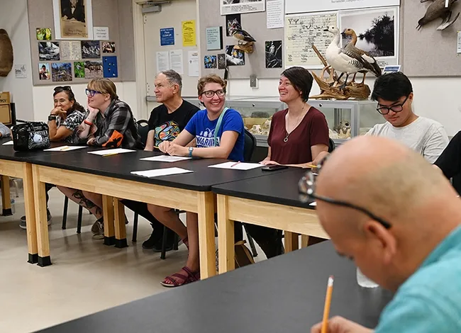 Participants in an insect drawing demonstration led by Professor Miguel Angel Miranda of the University of the Balearic Islands (UBI), Spain, listen intently. (Photo by Kathy Keatley Garvey)