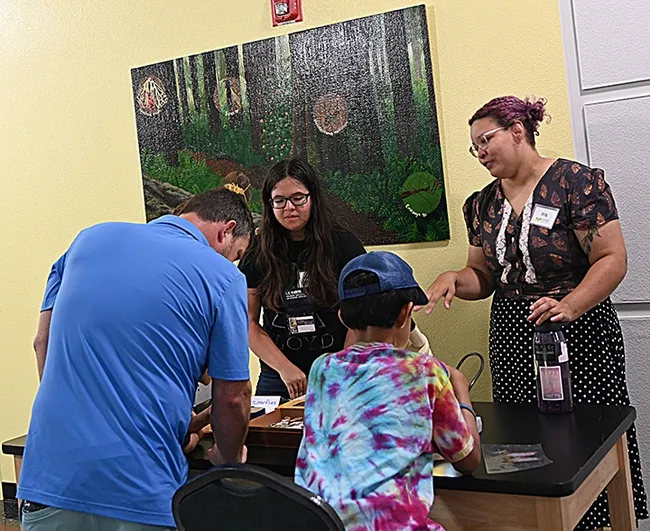Iris Quayle (right), a second-year doctoral student in the lab of Professor Jason Bond, UC Davis Department of Entomology and Nematology, fielded questions as did colleague Folsom Lake College graduate Julianna Campos. Campos is a former student of Folsom Lake College professor Fran Keller, a UC Davis doctoral alumna. (Photo by Kathy Keatley Garvey)