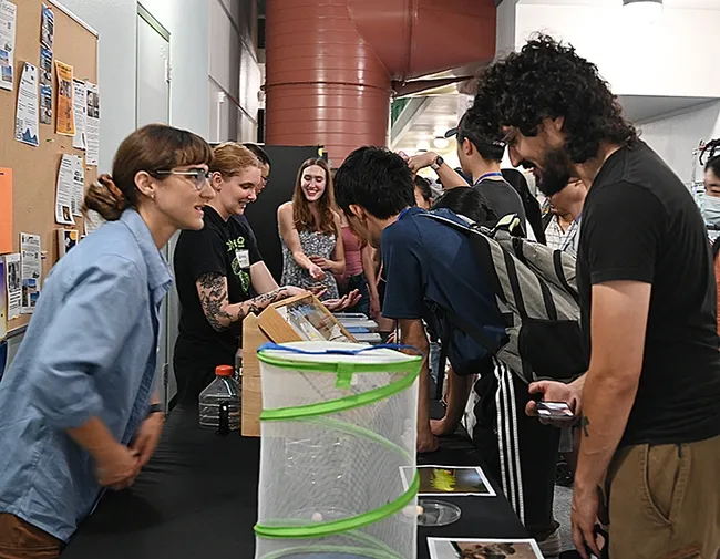Bohart Museum research associate Brittany Kohler (foreground, left) encouraged visitors to get acquainted with the insects in the live petting zoo. Next to her: doctoral student Emma Jochim of the Jason Bond lab, UC Davis Department of Entomology and Nematology. (Photo by Kathy Keatley Garvey)