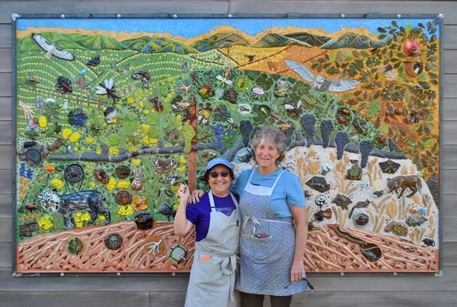 UC Davis distinguished professor Diane Ullman (right) with UC Davis retired lecturer artist/retired lecturer in the Department of Design, an integral part of the mural project.