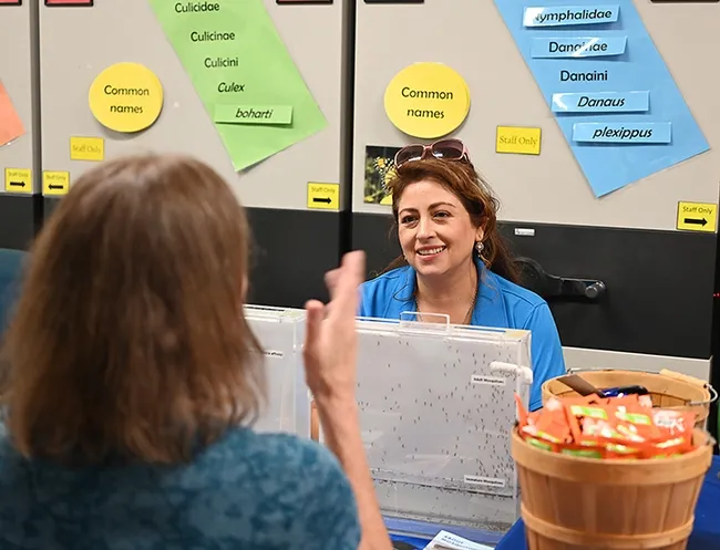 Luz Maria Robles, public information officer, Sacramento-Yolo Mosquito and Vector Control, answers a question about West Nile disease. (Photo by Kathy Keatley Garvey)