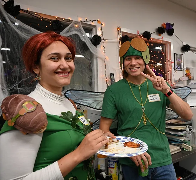 UC Davis first-year doctoral student CC Edwards and UC Davis doctoral candidate Christofer Edwards chat at the Halloween party. (Photo by Kathy Keatley Garvey)