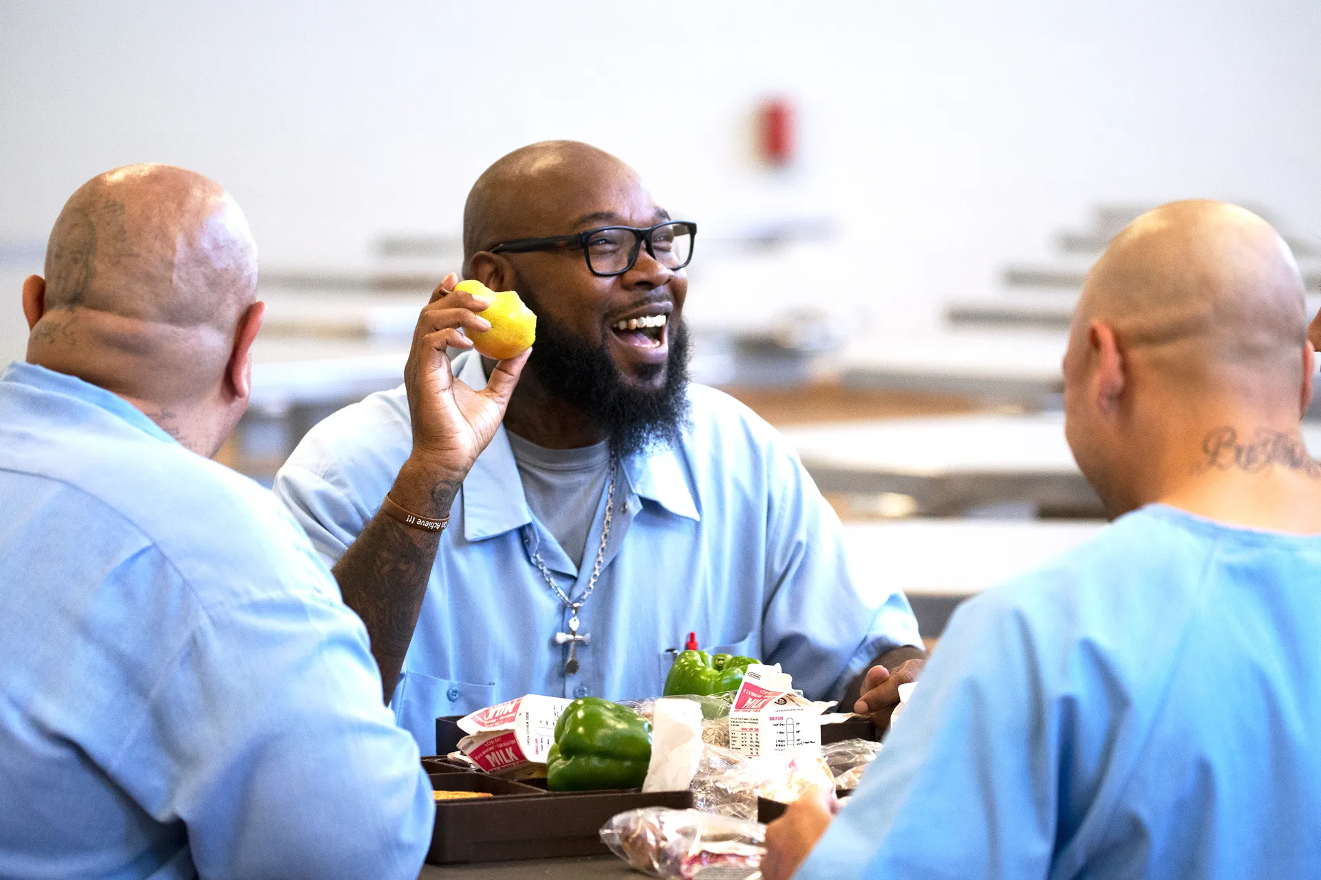 California State Prison Solano resident Patrick Range eating a local Bartlett pear. Photo credit: Evett Killmartin.