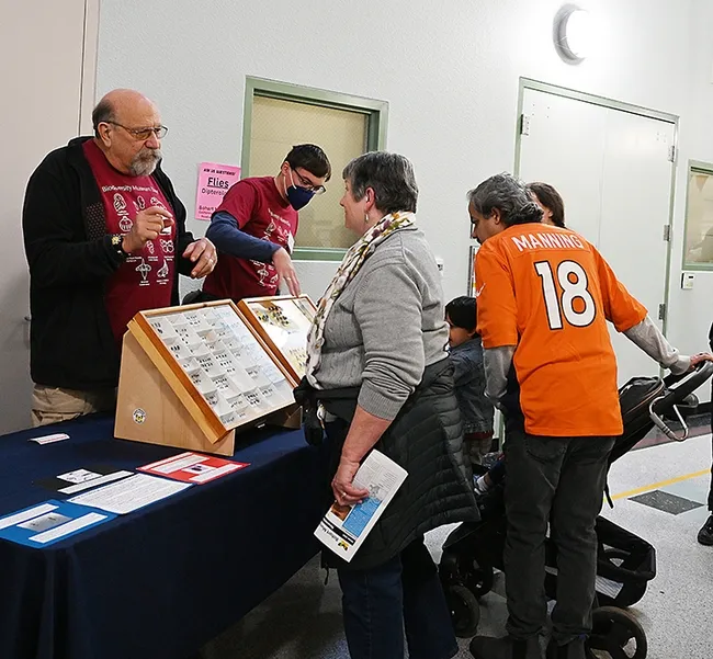 Forensic entomologist Robert Kimsey (left) of the Department of Entomology and Nematology and postdoctoral researcher Severyn Korneyev, a Ukrainian entomologist who studies flies, answer questions from visitors at the Bohart Museum open house. Korneyev holds a joint appointment with the UC Davis Department of Entomology and Nematology and the California Department of Food and Agriculture. (Photo by Kathy Keatley Garvey)