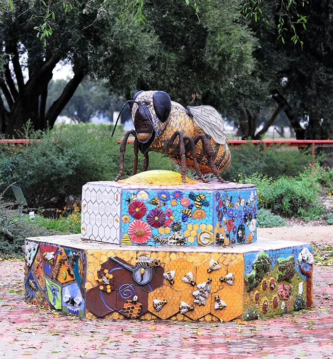 A ceramic-mosaic sculpture, "Miss Beehaven," anchors the UC Davis Bee Haven. It is the work of self-described "rock artist" Donna Billick of Davis. (Photo by Kathy Keatley Garvey)