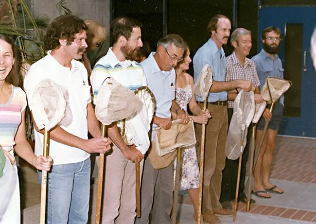 Back in 1986, Professor Richard "Doc" Bohart was given a 21-insect net salute when the museum he founded became "The Bohart Museum of Entomology." Lynn Kimsey, then a postdoctoral fellow, is in the left foreground.