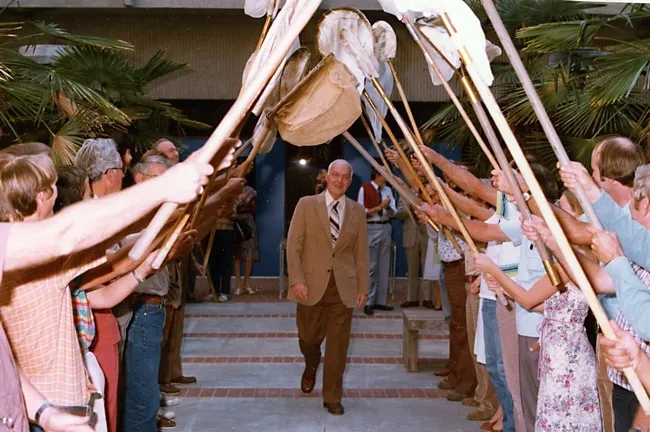 Noted entomologist Richard "Doc" Bohart walks beneath the archway of a 21-insect net salute in this 1986 image. The museum he founded in 1946 was dedicated to him in 1986.